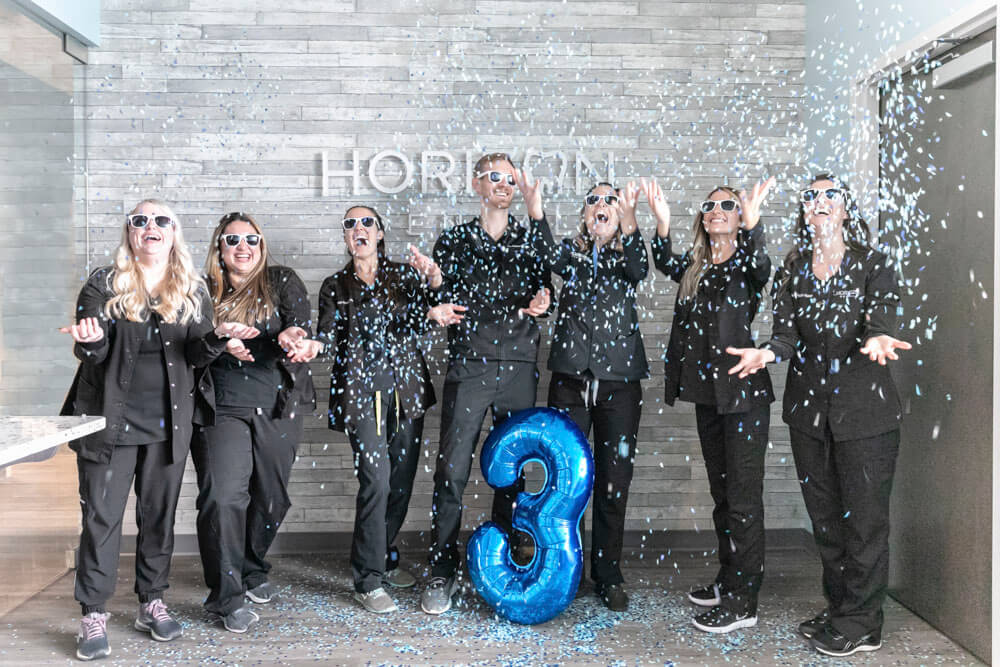 photo of the Horizon Dental team celebrating with confetti