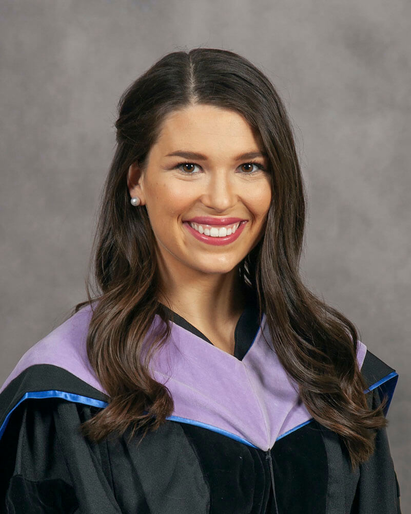 dr maggie sullivan of horizon dental with graduation gown on